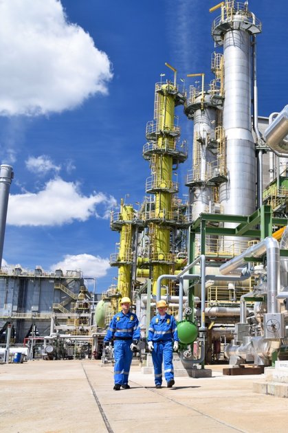 Two industrial workers discussing energy management